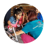 A young child receives physical therapy. 