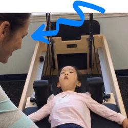 Aspire Physical Therapist with a child performing pilates to build strength.