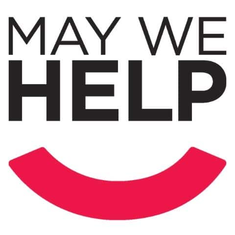 The May We Help logo. The logo is a simple design that reads, "May We Help" with a pink smile underneath.